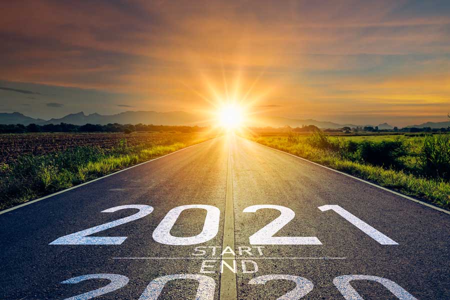 Picture of 2020 to 2021 transition with sun coming up over road. 2021 is predicted to be a business seller's market.